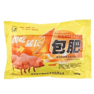 这是一袋猪用高档复合预混料的包装，整体为黄色，正面印有醒目的“傻吃猛长 1包肥”红色和黑色大字，下方有两只粉色猪的图案。包装上标注了产品类型为“猪用高档复合预混料II型”，含有精氨酸、赖氨酸、核心料、维生素及微量元素等成分，并注明了饲喂效果（猪儿皮红毛亮、贪吃好睡）和注意事项。出品公司为遂宁市天顺饲料有限公司，净含量1000g。