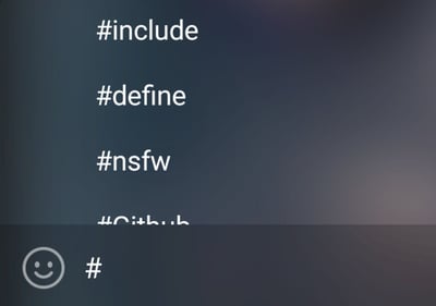 深色渐变背景上，白色文字垂直排列：#include、#define、#nsfw、#Cithub（部分字符被截断），底部有一个简单的微笑表情图标和单独的#号。这张图巧妙融合了C/C++编程语言中的预处理指令（#include用于包含头文件，#define用于宏定义）与互联网流行标签（#nsfw即Not Safe For Work，指不适合工作场合查看的内容），通过相似的#符号形式制造幽默反差，调侃程序员语境与网络文化的碰撞。