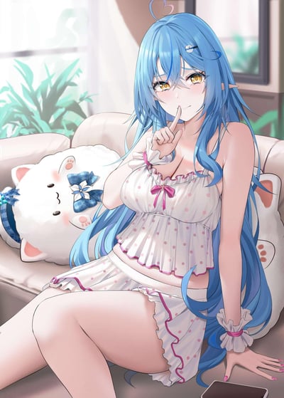 Anime-style illustration of a young girl with long blue hair and yellow eyes sitting on a beige couch. She is wearing white polka dot pajamas with pink ribbons and has a playful expression with her finger to her lips. Behind her is a white stuffed animal with blue bow and a window with green plants visible outside.