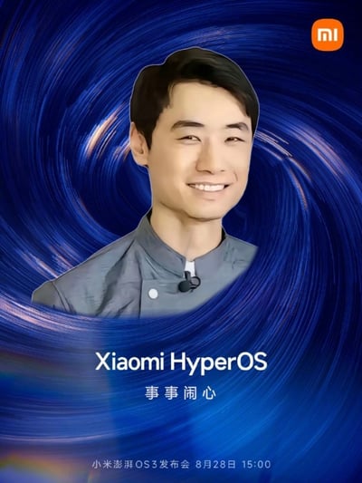 图片以蓝色漩涡为背景，中央为雷军的正面半身像，右上角有小米(MI)logo。下方依次显示文字“Xiaomi HyperOS”“事事闹心”及“小米澎湃OS3发布会 8月28日 15:00”。其中“事事闹心”是对常见祝福语“事事顺心”的恶搞改编，将“顺”改为“闹”以制造幽默调侃效果，整体风格模仿官方发布会宣传图但带有戏谑意味。