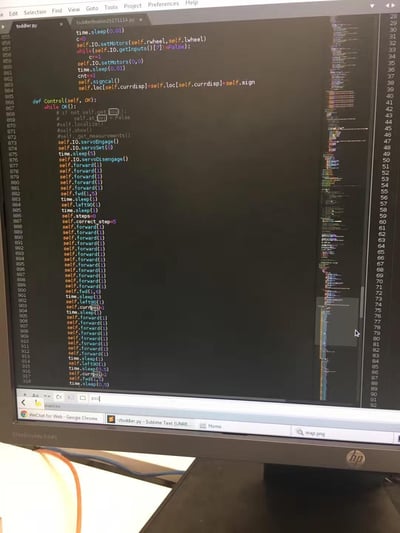 这是一张电脑屏幕实拍截图，展示了Sublime Text代码编辑器中打开的Python项目代码。代码内容为小型移动机器人的运动控制程序，包含电机驱动、舵机控制、机器人动作指令（前进、左转90度、定点移动等）、时间休眠、位置修正等功能代码，在`Control`方法中循环执行一系列预设的机器人移动动作，看起来是开发者在编写或调试机器人路径控制逻辑的场景。