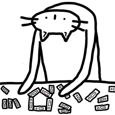 这是一幅黑白线稿图，描绘了一只卡通猫咪的形象。猫咪有着大大的头部，小小的圆形眼睛，两侧各有三根胡须，嘴巴向下弯曲，呈现出悲伤或困惑的表情。它坐在地上，长长的前腿向前伸展，身前散落着一些长方形的积木（类似多米诺骨牌或小方块），其中部分积木被摆成了一个类似房子的形状，但看起来已经倒塌。背景是纯白色，没有其他元素，整个画面简洁，突出了猫咪和散落积木的主体。图中没有任何文字或对白内容。