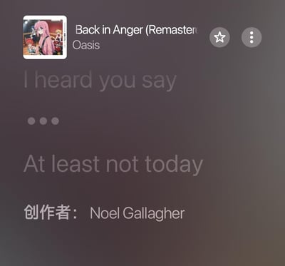 这是一张音乐播放软件的界面截图，内容为英国摇滚乐队Oasis的重制版歌曲《Back in Anger》的播放页面，用户将原本的专辑封面替换成了动画《孤独摇滚！》的乐队成员截图（包含主角后藤独/波奇酱、伊地知虹夏、山田凉、喜多郁代）。界面中展示了部分歌曲歌词：“I heard you say...At least not today”，同时标注了该歌曲的创作者为Noel Gallagher，整体呈现出音乐与动画结合的趣味二次创作效果。