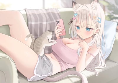 画面呈现出居家场景里的温馨瞬间：一位银发蓝眼的猫耳少女穿着粉色吊带与灰色短裤，慵懒地倚靠在沙发靠垫上，一只手举着粉色手机，另一只手放在胸前，脸颊带着淡淡的红晕，额角挂着汗珠，神情有些害羞又慵懒。一只灰白斑纹的小猫趴在少女的腿上，前爪抬起，正好奇地凑向少女的手机，整体氛围治愈又充满居家的松弛感。
