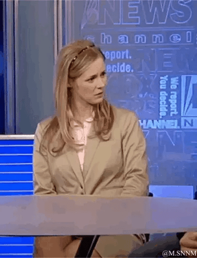 这是一段动态GIF，画面呈现新闻演播室场景：一位身着米色西装的女主播坐在新闻播报台后，原本姿态端正，随后突然露出震惊又夹杂着嫌弃的表情，身体向后退缩，生动表现出对听到的内容极度意外、难以接受的情绪。背景是带有"NEWS channel""We report. You decide."等英文标识的新闻演播室背景板，整体氛围贴合新闻播报场景，却因主播的夸张反应充满喜剧效果。