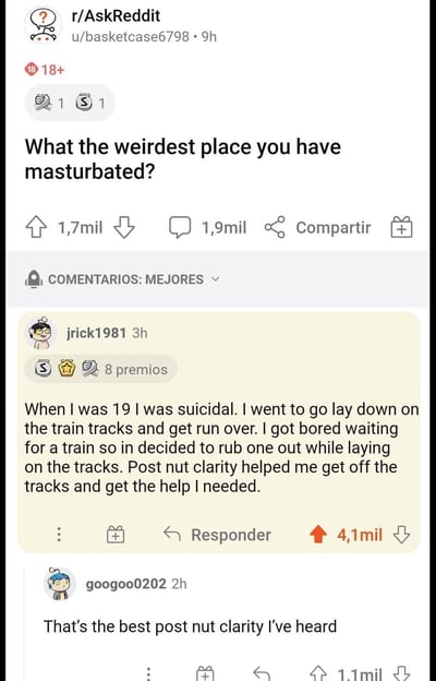 这是一张Reddit论坛r/AskReddit板块的帖子截图，标题为“What the weirdest place you have masturbated?”（你自慰过的最奇怪的地方是哪里？）。帖子下方有一条高赞评论来自用户jrick1981，讲述了自己19岁时因自杀倾向躺在铁轨上，等待火车时感到无聊而自慰，随后“射精后清明”（post nut clarity）让他放弃自杀并寻求帮助的经历。另一条评论来自googoo0202，称这是他听过的最棒的“射精后清明”案例。